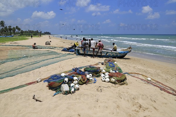 Traditional fishing hauling nets Nilavelli beach, near Trincomalee, Eastern province, Sri Lanka, Asia