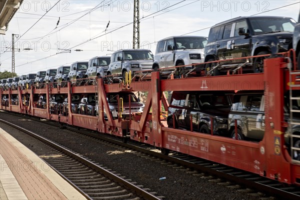 Passing goods train transporting brand-new cars, main railway station, Witten, North Rhine-Westphalia, Germany, Europe