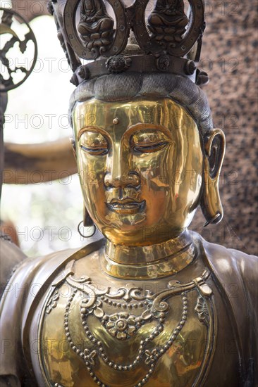 Brass Buddha figure, Gangaramaya Buddhist Temple, Colombo, Sri Lanka, Asia