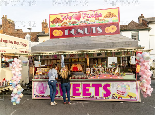 Mops fair fairground, High Street, Marlbrough, Wiltshire, England, UK October 7th 2023, Donuts and Sweets stall