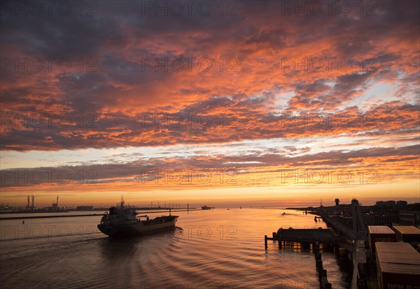 Sunset orange glow landscape clouds water, North Sea shipping, Port of Rotterdam, Hook of Holland, Netherlands