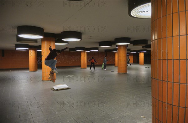 Germany, Berlin, 15.11.2023, Messedamm subway, orange columns, skaters, Europe