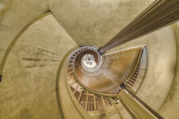 A detailed view of a spiral staircase with a spiral banister in beige tones, Schachtrupp Villa, Lost Place, Osterode am Harz, Lower Saxony, Germany, Europe