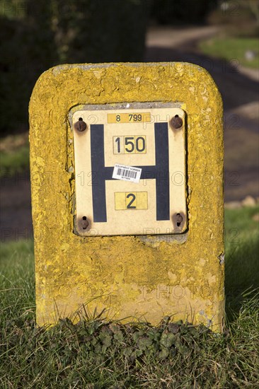 Close up of yellow water hydrant sign, UK