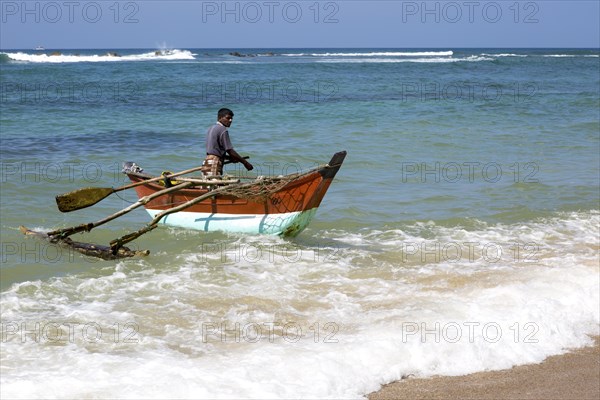 Fishing using traditional outrigger canoes, Mirissa, Sri Lanka, Asia