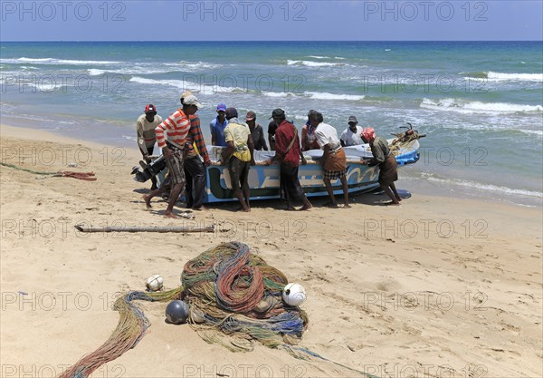 Traditional fishing hauling nets Nilavelli beach, near Trincomalee, Eastern province, Sri Lanka, Asia