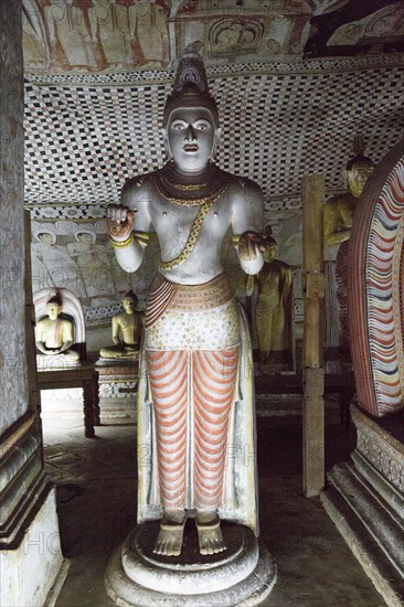 Buddha figure inside Dambulla cave Buddhist temple complex, Sri Lanka, Asia