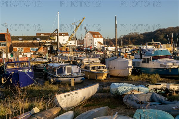 Boats and houseboats near the Tidemill, River Deben, Woodbridge, Suffolk, England, UK