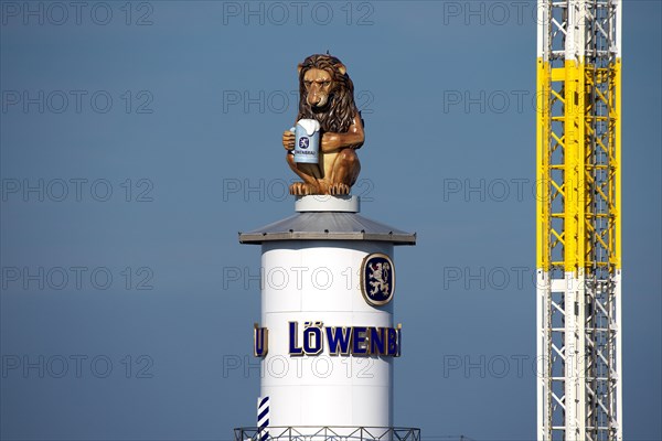Oktoberfest, afternoon, Lion of the Loewenbraeu brewery on the tower of the festival tent, Munich, Bavaria, Germany, Europe