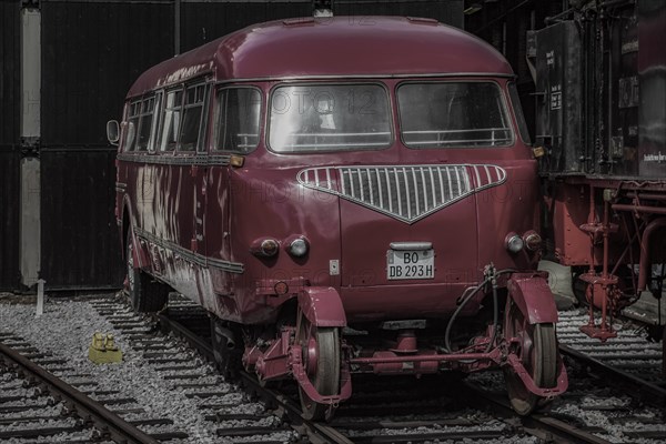 A red vintage rail bus parked on railway tracks in a museum, Dahlhausen railway depot, Lost Place, Dahlhausen, Bochum, North Rhine-Westphalia, Germany, Europe