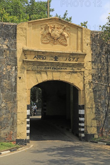 Main gate entrance in walls of historic Fort Frederick, Trincomalee, Sri Lanka, Asia dated 1675 'Dieu et mon Droit' coat of arms, Asia
