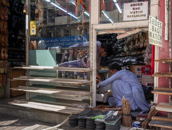 Shoe shops and craftsmen in the Al Fahidi neighbourhood, Dubai, United Arab Emirates, Asia