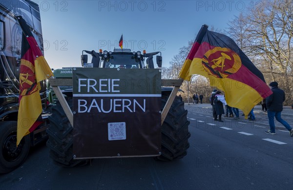 Germany, Berlin, 08.01.2024, Protest of farmers in front of the Brandenburg Gate, nationwide protest week against policies of the traffic light government and cuts for farms, GDR flags, Europe