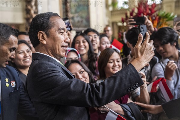 Joko Widodo, the President of Indonesia, takes selfies during a visit to Manila, Philippines 11/01/2024