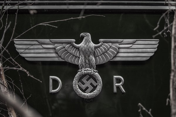 An eagle emblem with spread wings and a swastika, symbol from the time of the Second World War, Dahlhausen railway depot, Lost Place, Dahlhausen, Bochum, North Rhine-Westphalia, Germany, Europe