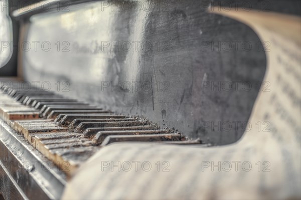 An old, dust-covered piano with worn black and white keys, urologist's villa Dr Anna L., Lost Place, Bad Wildungen, Hesse, Germany, Europe