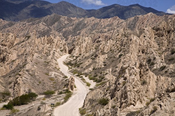 Winding dirt road though the Quebrada de las Flechas, Salta Province, Argentina, South America