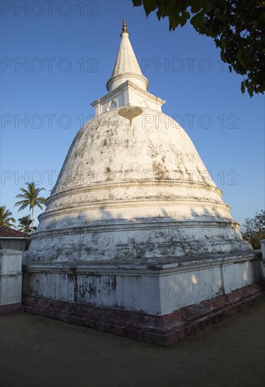 White stupa dome of Buddhist temple at Mirissa, Sri Lanka, Asia