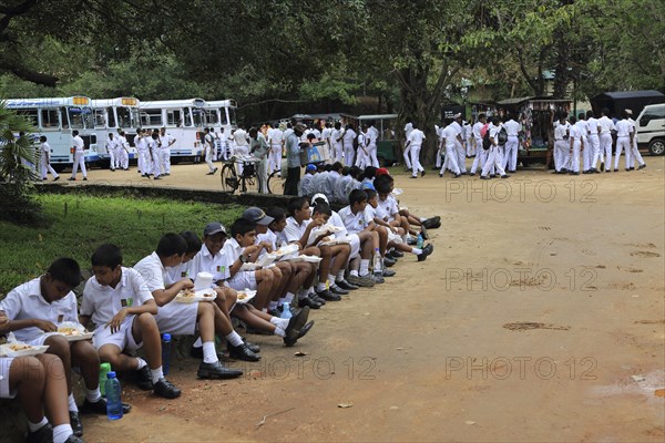 Large groups of school children visiting Polonnaruwa, North Central Province, Sri Lanka, Asia