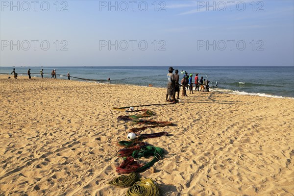 Traditional fishing hauling nets Nilavelli beach, near Trincomalee, Eastern province, Sri Lanka, Asia