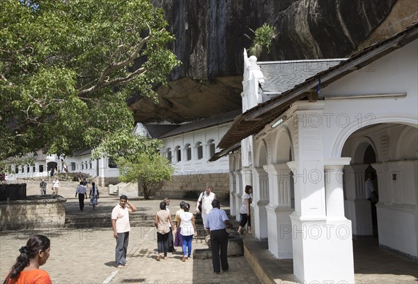 People at Dambulla cave Buddhist temple complex, Sri Lanka, Asia