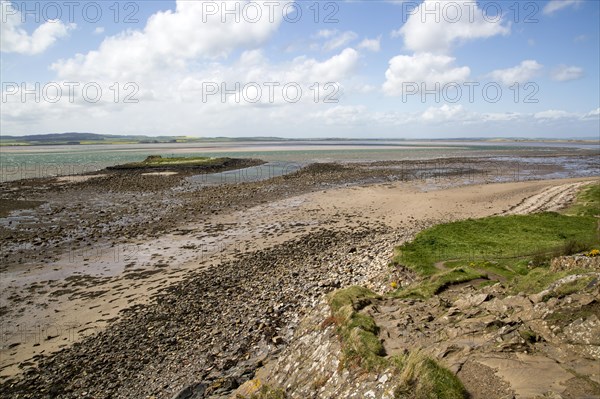 Coastal landscape looking inland at low tide, Holy Island, Lindisfarne, Northumberland, England, UK