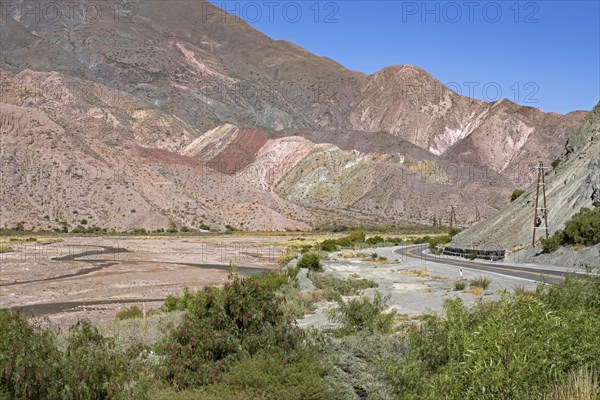 National Route 9 following the Grande River, Rio Grande in the Quebrada de Humahuaca, mountain valley in the Jujuy Province, northwest Argentina