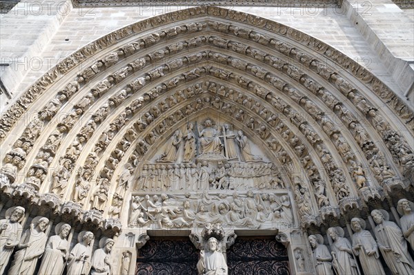 Detail of the Gothic main portal, Notre-Dame de Paris Cathedral, Paris, France, Europe
