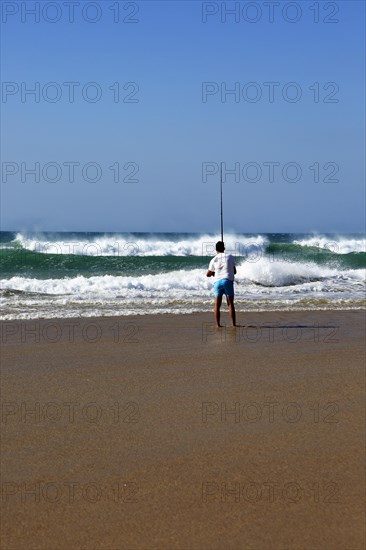 Man fishing from the beach at Conil de la Frontera, Cadiz province, Spain, Europe