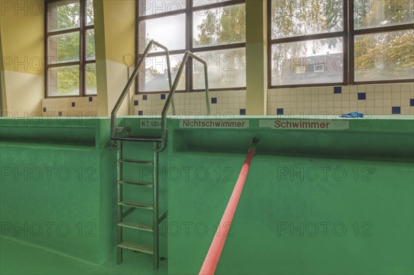 Abandoned swimming pool with signs for non-swimmers and swimmers' areas, Bad am Park, Lost Place, Essen, North Rhine-Westphalia, Germany, Europe