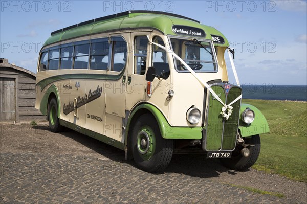 Antique motor coach seen on Holy Island, Lindisfarne, Northumberland, England, UK