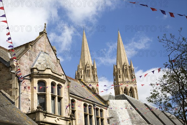 Spires of cathedral rise above historic town centre buildings, Truro, Cornwall, England, UK