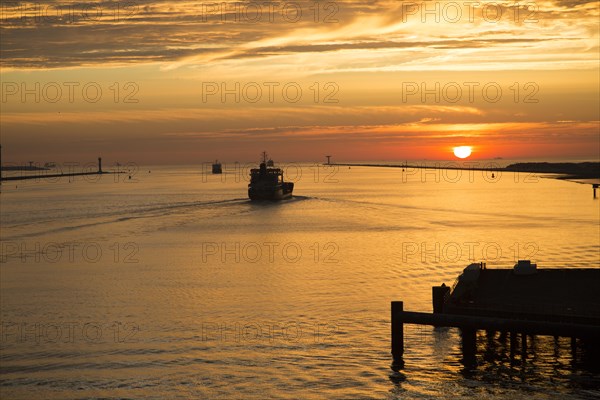 Sunset orange glow landscape clouds water, North Sea shipping, Port of Rotterdam, Hook of Holland, Netherlands