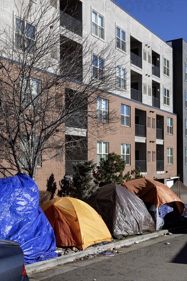 Denver, Colorado, Immigrants, mostly from Venezuela, live in a tent camp near downtown Denver. The city helped about 35, 000 migrants in 2023 with food and temporary shelter, but more continue to arrive daily on buses from the southern border