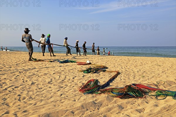 Traditional fishing hauling nets Nilavelli beach, near Trincomalee, Eastern province, Sri Lanka, Asia