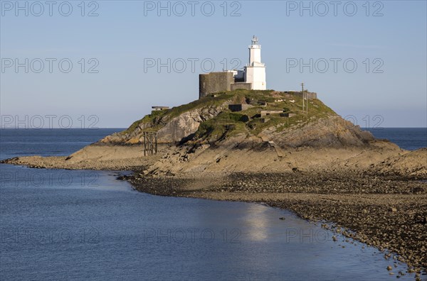 Lighthouse at low tide Mumbles Head, Gower peninsula, near Swansea, South Wales, UK