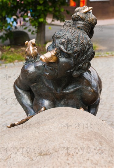 Bronze sculpture, statue, sculpture, sculpture, bronze witch grandmother Wadelinde, naked woman with very big nose, grimace, wild hairstyle, wild hair and rat on her shoulder pushes boulder, portrait, portrait, part of the group of figures with devil and homunculus, Hexentanzplatz, Thale, Eastern Harz, Harz, Saxony-Anhalt, Germany, Europe