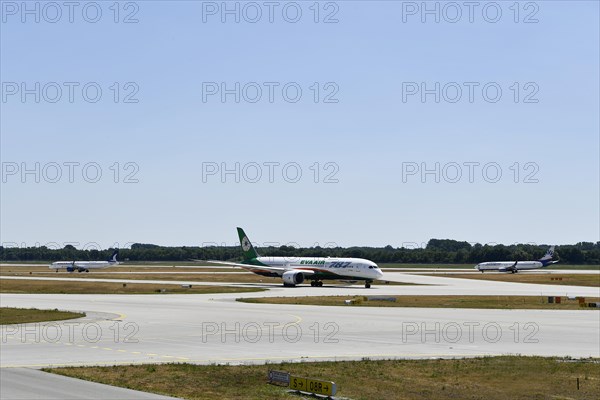 Eva Air Dreamliner, SunExpress and Anadolujet Airlines aircraft taxiing on the taxiways at Runway South, Munich Airport, Upper Bavaria, Bavaria, Germany, Europe