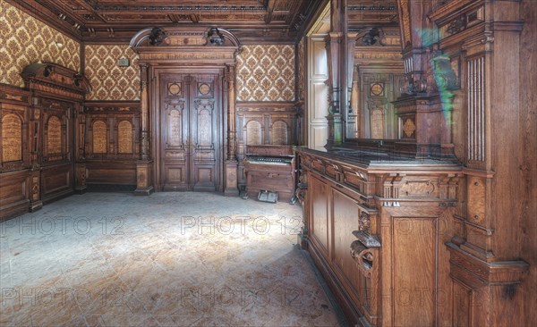 A room steeped in history with elaborate wood carvings and reflections in the window, Villa Woodstock, Lost Place, Wuppertal, North Rhine-Westphalia, Germany, Europe