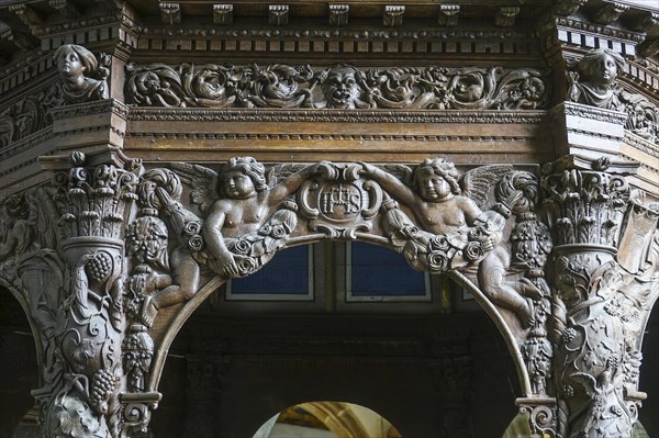 Renaissance-style carved canopy of the baptismal font, Enclos Paroissial enclosed parish of Guimiliau, Finistere Penn ar Bed department, Brittany Breizh region, France, Europe