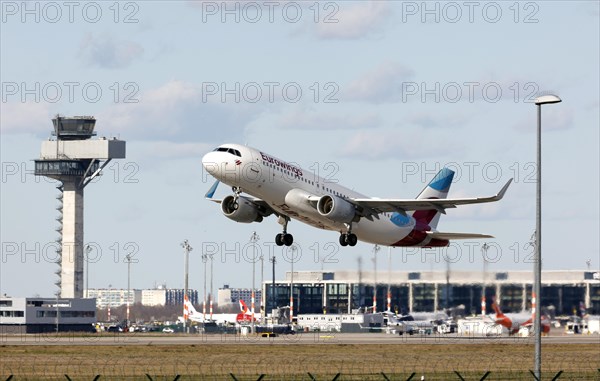 An Airbus A-320 of the airline Eurowings takes off at BER Berlin Brandenburg Airport Willy Brandt, Schoenefeld, 28/03/2023