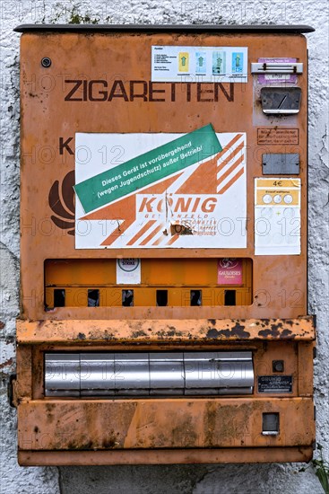 Rotten, rusty cigarette vending machine, device temporarily out of service due to youth protection, on a wall, protection, children, youth, Germany, Europe