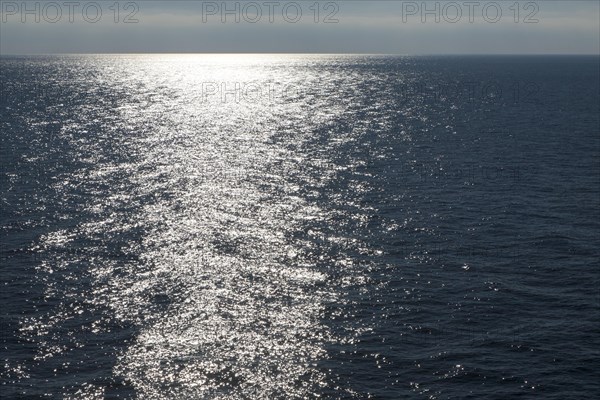 Sunlight at dusk on calm water of the Mediterranean Sea