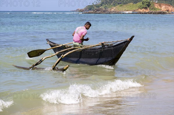 Fishing using traditional outrigger canoes, Mirissa, Sri Lanka, Asia