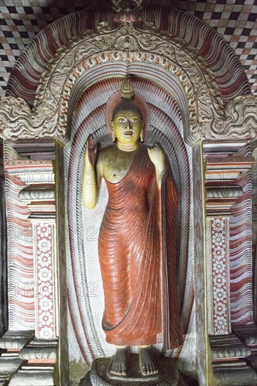 Buddha figure inside Dambulla cave Buddhist temple complex, Sri Lanka, Asia