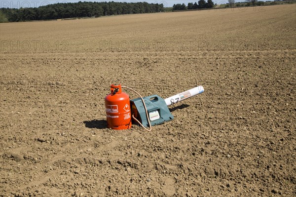 Scatterer gas canister bird scarer on farmland, Sutton, Suffolk, England, UK