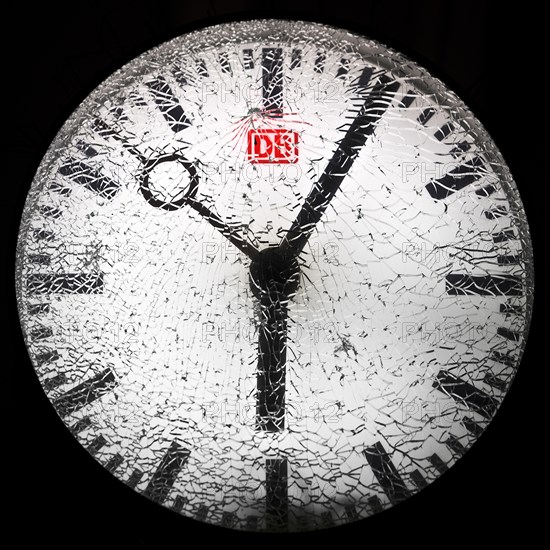 Shattered glass on a railway station clock at night, detail, symbolic photo, Witten, North Rhine-Westphalia, Germany, Europe