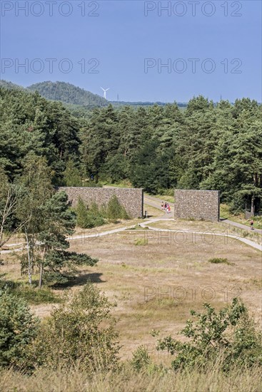 Tourists walking through entrance gate of the Mechelse Heide, heathland in the Hoge Kempen National Park, Limburg, Belgium, Europe