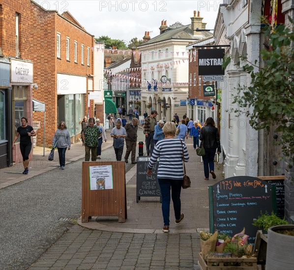 People shopping in pedestrianised High Street, The Thoroughfare, Woodbridge, Suffolk, England, UK