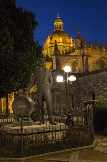 Cathedral church in Jerez de la Frontera, Cadiz province, Spain with Tio Pepe statue at night